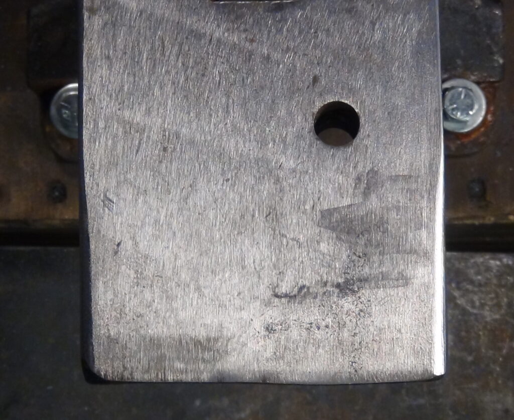 1/4" radius approximately 2" long on both sides of the heels. This was done with the angle grinder.
