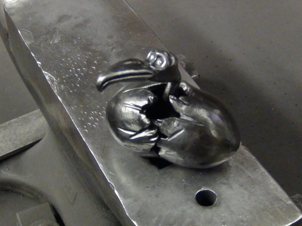 The baby getting a good feel for the anvil face. 