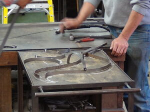 Forming the body with light gauge metal.