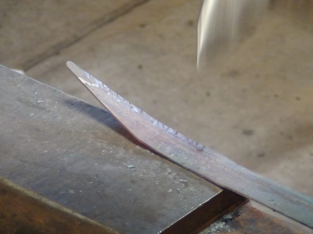 After veining each feather, the "texturing" was done with a cross pein. 