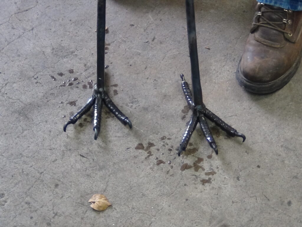 A couple days into it and the first wing was complete and the feet were ready to attach to the body. 