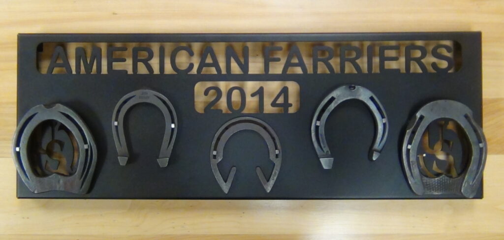 A close-up of the American Farrier's Team Plaque