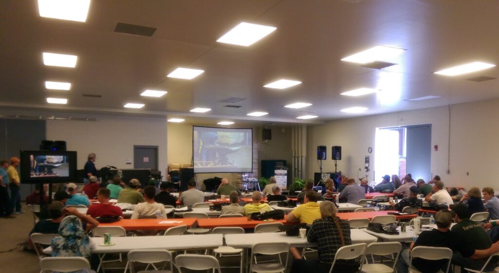 Attendees watch the shoeing demonstration.