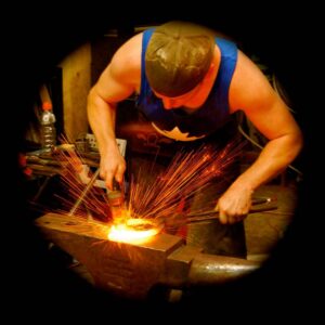 Dan Corkery welding a barshoe at a practice. Photo credit: Rachael Brassard.